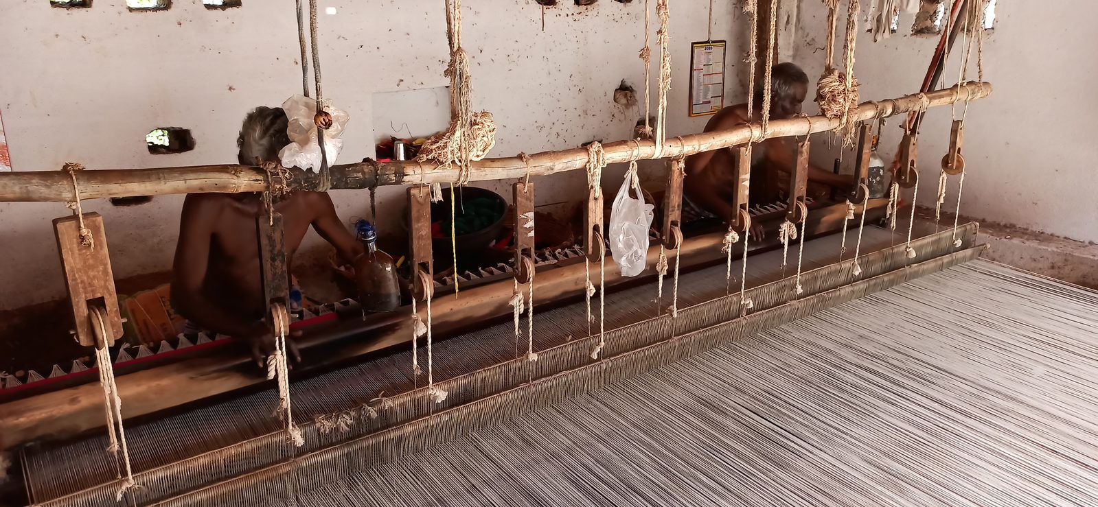 Weavers at a 10 feet wide double Jamakkalam loom