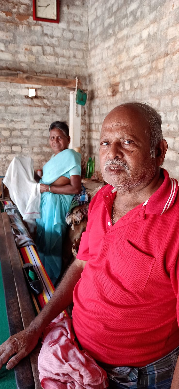 Mr. Sakthivel and his sister weaving on the loom